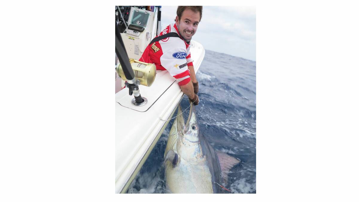 SOLID CATCH: Scott McGrath shows off his impressive sized black marlin.