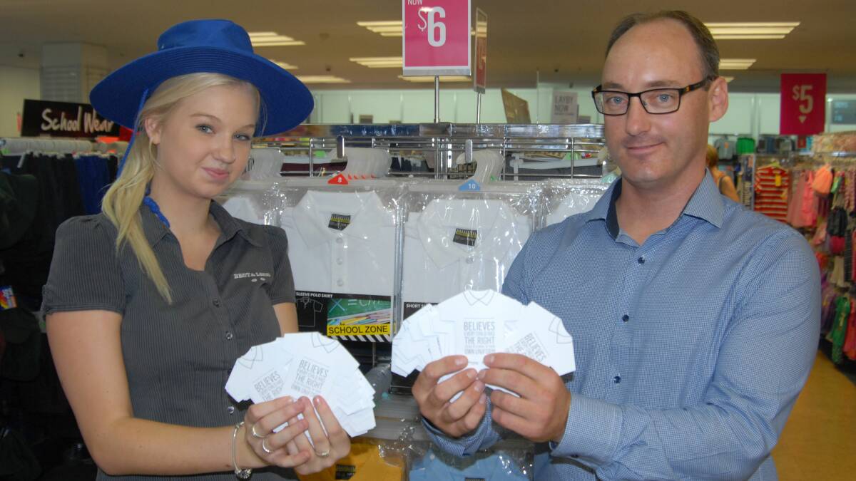 DOUBLE TROUBLE: Nowra’s Best & Less team member Melissa Warton and store manager Jason Wilson are hard at work helping disadvantaged children get ready for school.