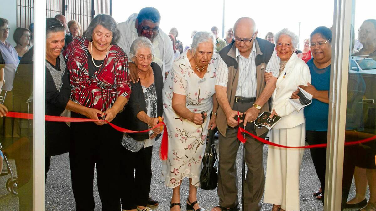 OPEN: Elders from the local Aboriginal community open the new Cullunghutti Aboriginal Child and Family Centre on Monday. From left: Aunty Jenny Wellington, Aunty Nellie Mooney, Aunty Jean Davenport, Uncle Tom Moore, Aunty Bertha Bloxsome, Uncle Willie Bloxsome, Aunty Ruth Simms and Aunty Grace Crossley. Photo: JODEE CAPLE