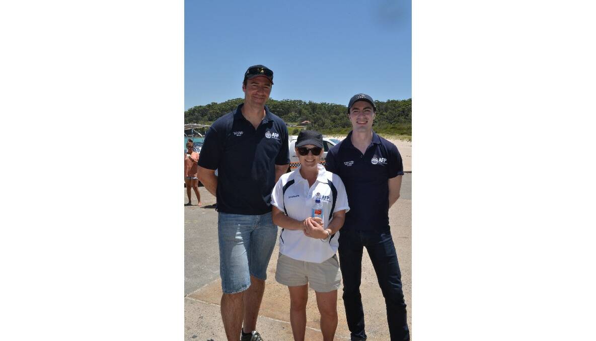 AFP photographer Mike Punch, AFP media Emma Gerard enjoy catching up with the excited children at the Australian Federal Police and Wreck Bay indigenous community ‘Off the Hook’ kids’ fishing fun day at Summercloud Bay on Wednesday. 