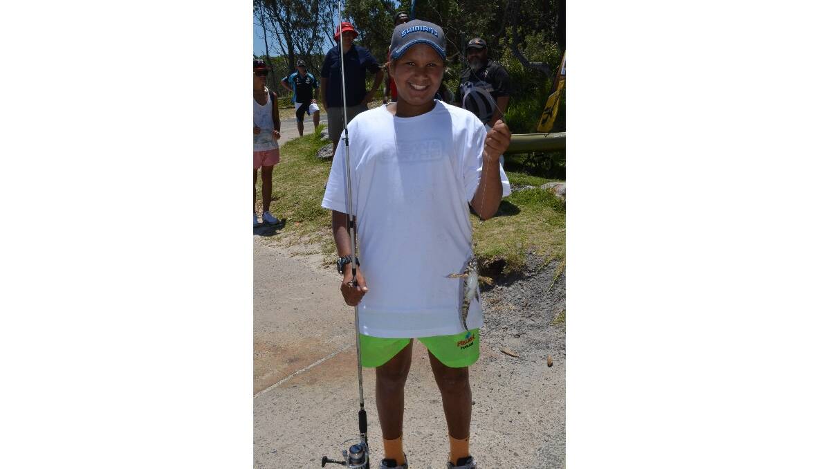 Joseph Simpson from Bomaderry is excited to catch a fish at the Australian Federal Police and Wreck Bay indigenous community ‘Off the Hook’ kids’ fishing fun day at Summercloud Bay on Wednesday. 