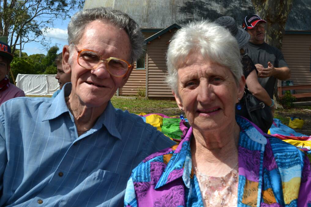 SOAKING UP THE SUN: At the Huskisson Anglican Church Free Christmas Family Fun Time on Sunday, December 8 are Keith and Helen Ruttley of Vincentia. 