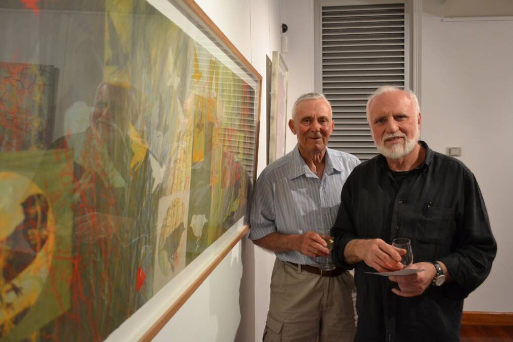 PROUD: Jim Bradley is proud of her daughter-in-law’s exhibit with co-sponsor from Kiosk John Fergusson with Julie Bradley’s painting absence and presence at the NOW: Shoalhaven Contemporary Art Prize exhibition at the Shoalhaven City Arts Centre in Nowra on Saturday.