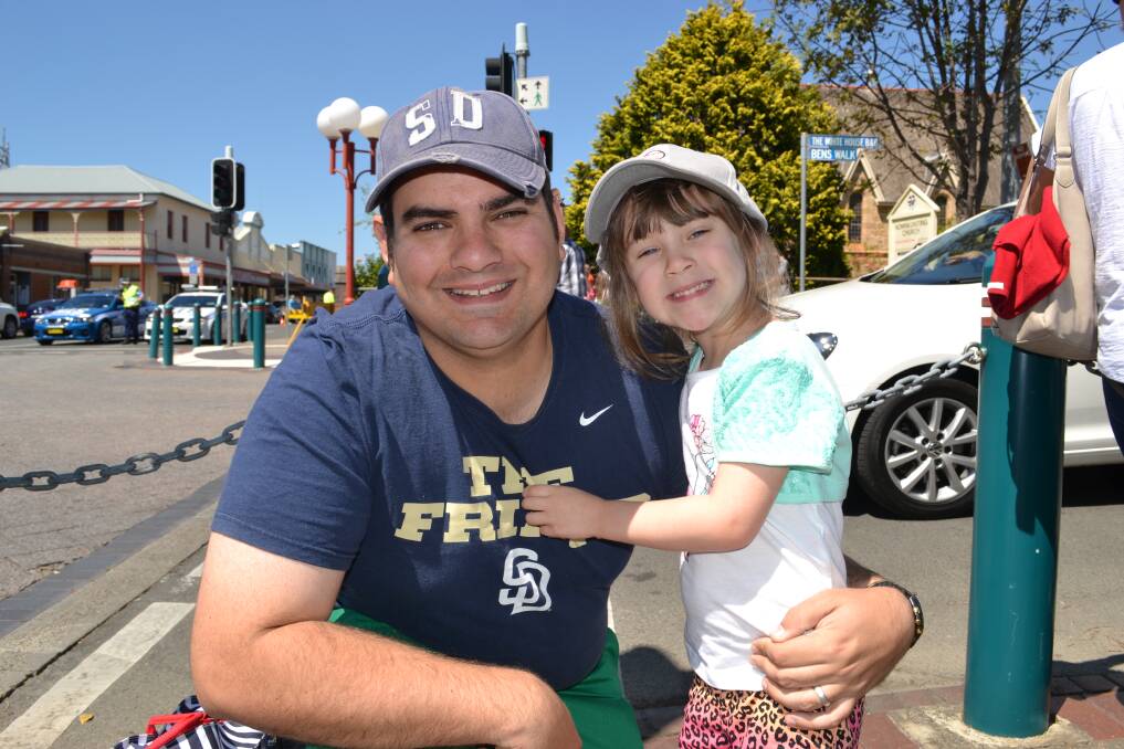 PARADE WATCHERS: Scott and Grace Deakes from Nowra having fun at the Shoalhaven River Festival Parade on Saturday.