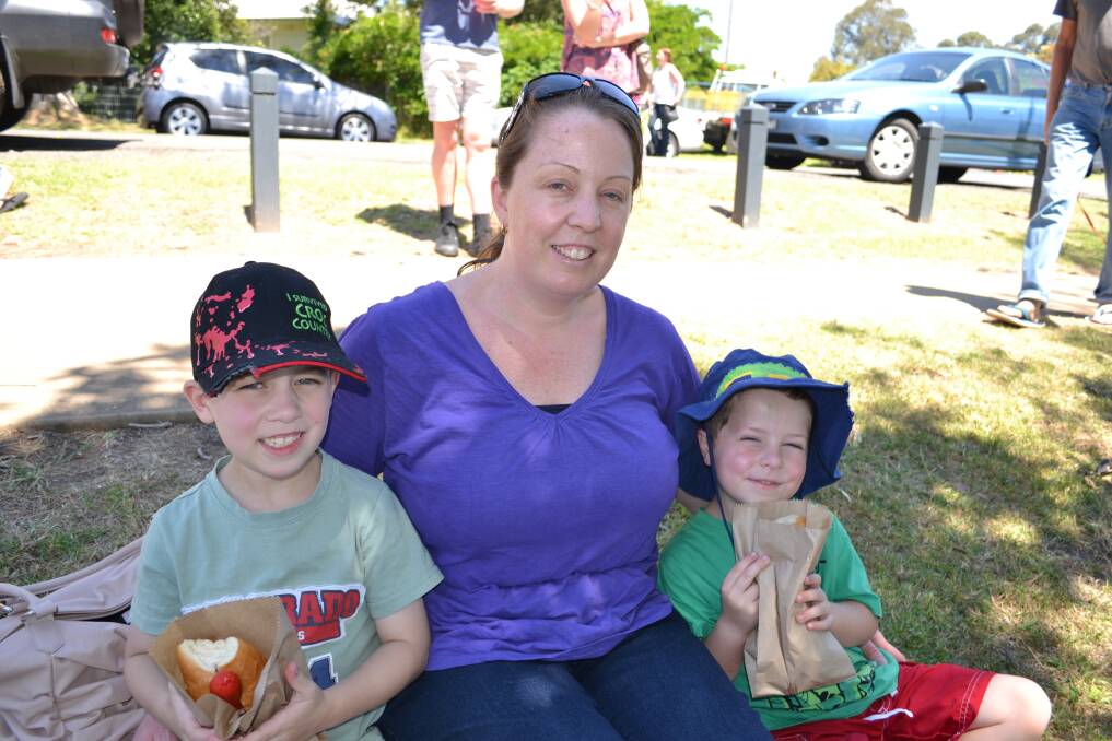 GOING WITH THE FLOW: Riley, Christine and Jack Dover from Nowra Having a great time at the Shoalhaven River Festival held on the banks of the River on Saturday.