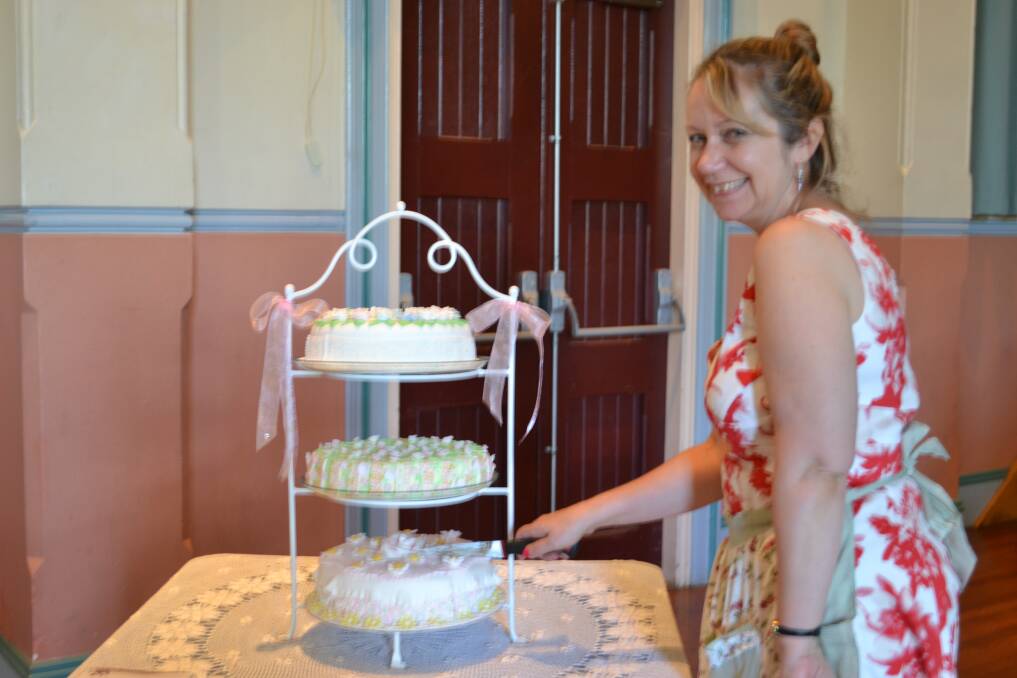 CAKE CUTTING: Melissa Hedger from Callala Bay cuts a celebratory cake at the Women and IT high tea to celebrate International Women’s Day.