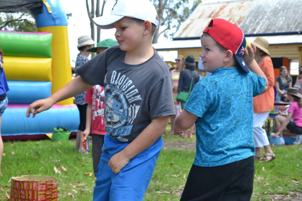 SURE SHOTS: Sebastian and Charish Kennedy from Vincentia try their luck at the Huskisson Anglican Church’s annual Free Christmas Family Fun Time on Sunday, December 8. 