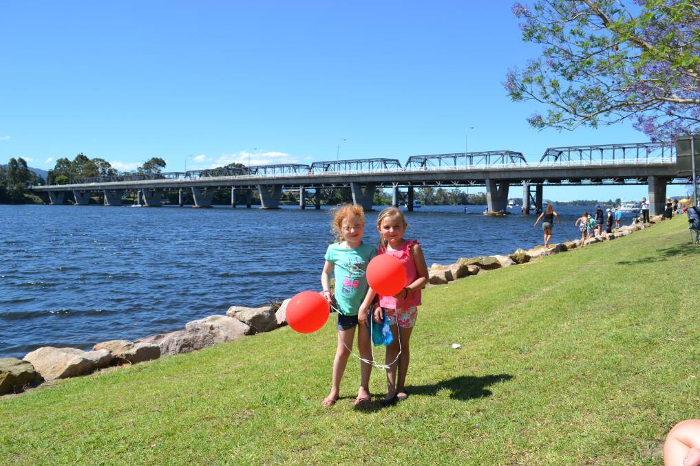 RIVER REVELLERS: Amelia D'Arcy from Nowra and Lily Fuz from Worrigee having a great time at the Shoalhaven River Festival held on the banks of the River on Saturday.
