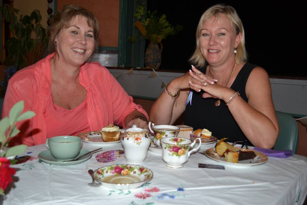 FUN & INFORMATIVE: Karen Sharpe and Kimberley Clarke from Shoalhaven Heads enjoy an afternoon of high tea and talks on IT at the Nowra School of Arts on Saturday to celebrate International Women’s Day