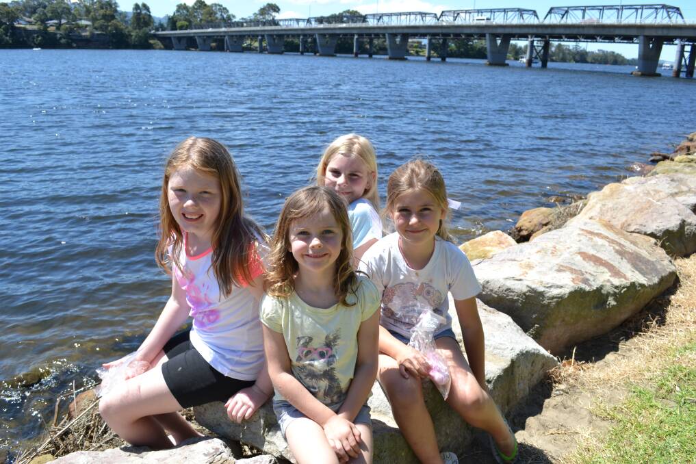 WATERFRONT: Charlotte Hinds, Imika Roberts and Suzie Fischer and Ellie Fischer all from Nowra test the water at the Shoalhaven River Festival held on the banks of the River on Saturday.