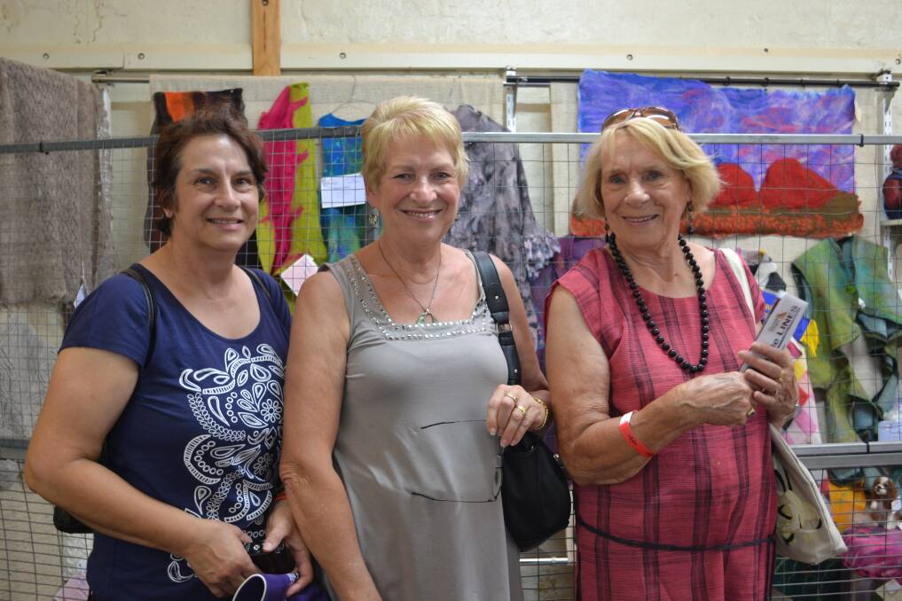 CRAFT DISPLAY: Dianna Blackie from Bomaderry, Adriana Hussey from Worrigee and Josie Gensen from Nowra admire the craft display in the Pavilion.