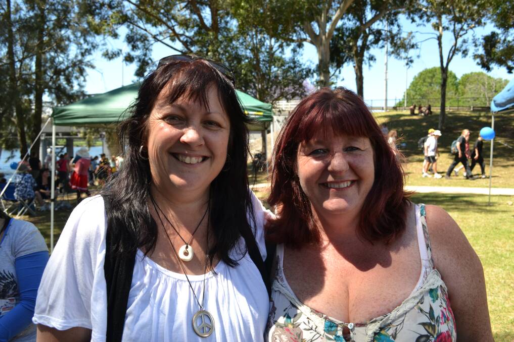 PLACE IN THE SHADE: Holly Lynch from Shoalhaven Heads and Karen Dawson from Culburra having a great time at the Shoalhaven River Festival held on the banks of the River on Saturday.