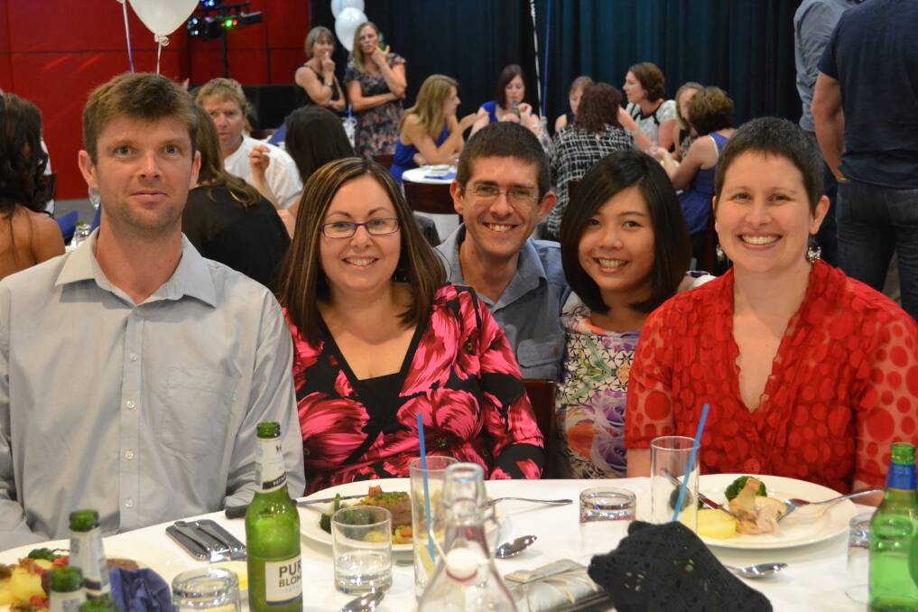 SHARING STORIES: Shane and Cheryl Bergin from Canberra, Paul and Aphinya Ripke from Sydney and Amy Davey from Nowra enjoy themselves at the Nowra High Class of 92 Reunion on Saturday night.