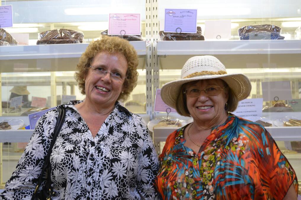 COMPETITION: Anita dela Motte from Bomaderry and Margaret Ormsby from New Zealand take a look at the entries in the cake competitions at the Nowra Show