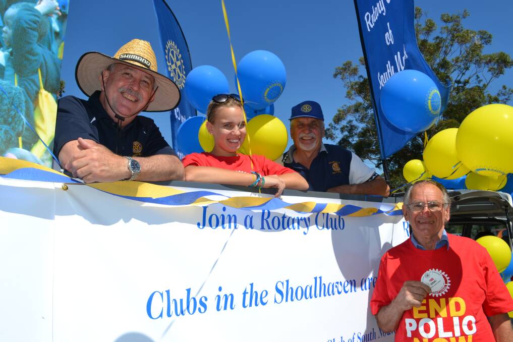 ROTARY AFLOAT: Greg Mcleod from Nowra, Lilla Hoppenthaler from Hungary, Stuart Dossetor from Worrigee and Phillip Speers from Bomaderry have a great time preparing for the Shoalhaven River Festival Parade on Saturday.