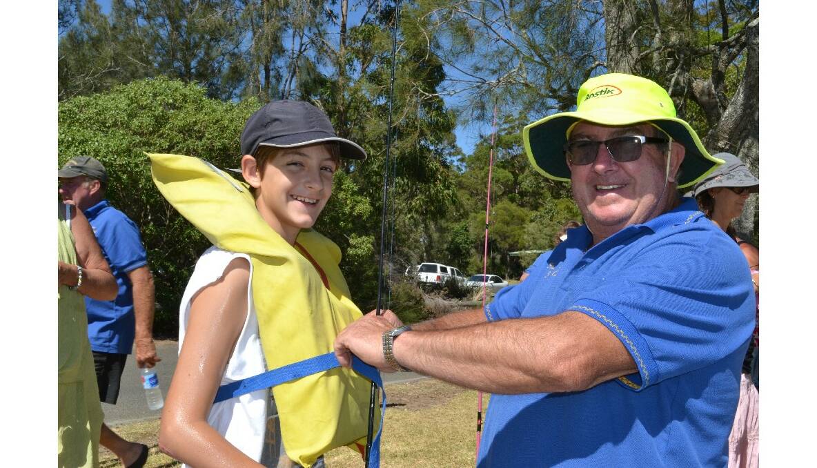 KITTING UP: Adrijan Ilic, of Sydney gears up for the Huskisson RSL Fishing Club’s fishing school with club member Larry Sheldrick.