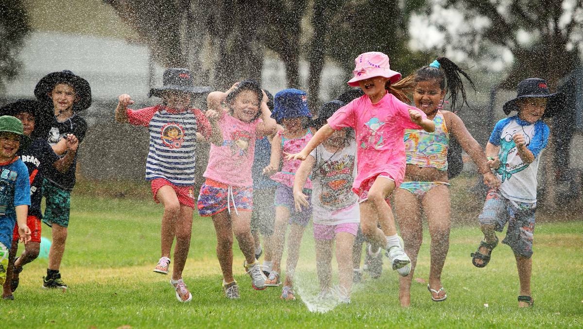 Albury North Public School students enjoy the classic Aussie past-time of running through the sprinkler during the school's water sports day. Picture: MATTHEW SMITHWICK, Border Mail