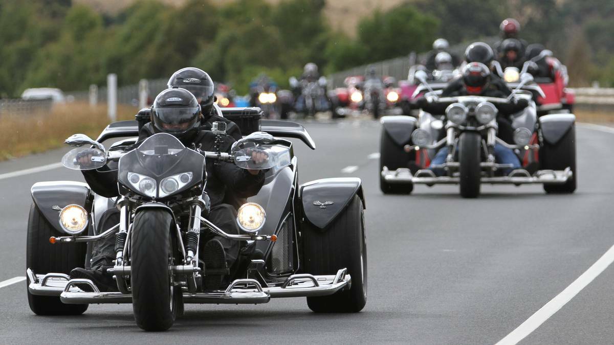 Participants in the Aussie Trikefest make their way along the Bass Highway at Ulverstone. The Advocate, Burnie