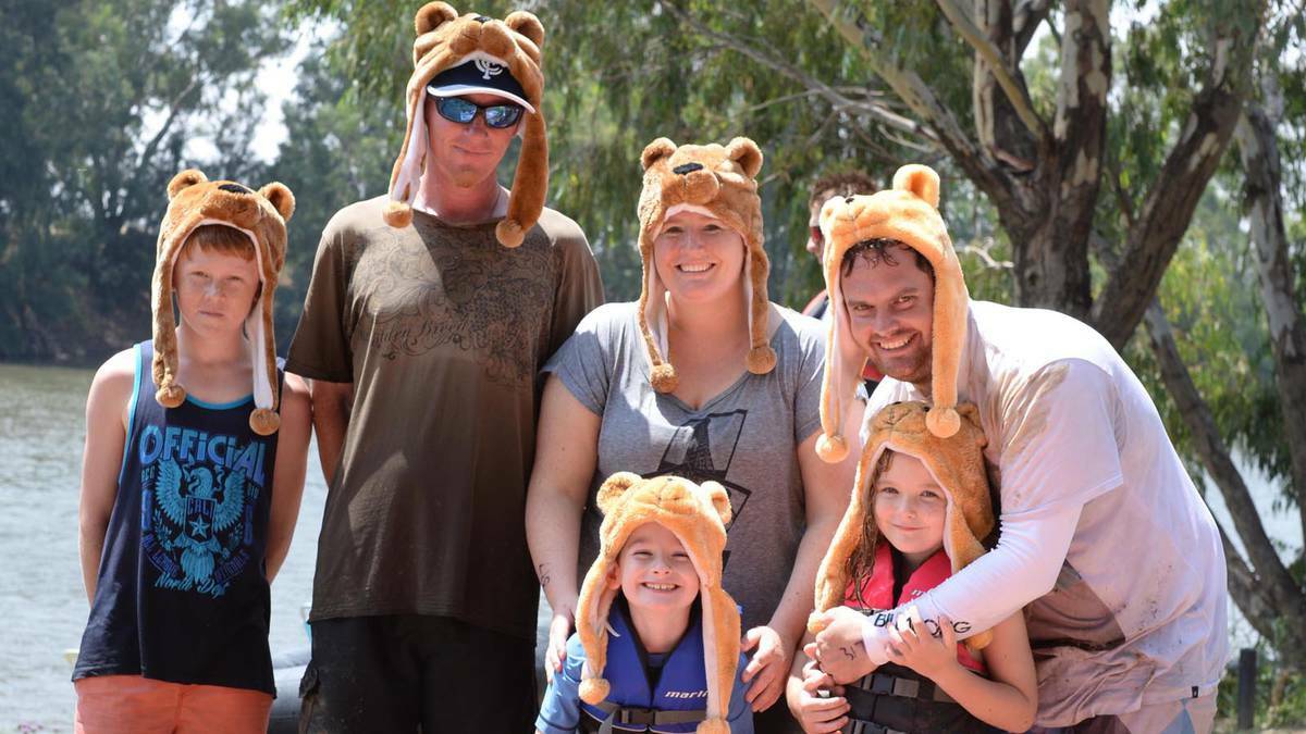 Caleb and Chris Hogg, Katherine Parker and Brett, Liam and Kirstin Fletcher were wet and muddy after the Gumi race. Picture: Jacinta Coyne, Daily Advertiser
