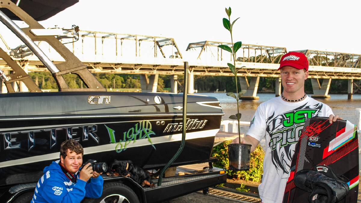 LEND A HAND: Nathan Peters captures Johny Vynes with a mangrove tree in preparation for this Sunday’s boating day.