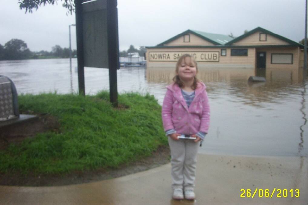  Paul Bannon’s photo of his daughter Makenzie (4) in front  of the Nowra Sailing Club under water.