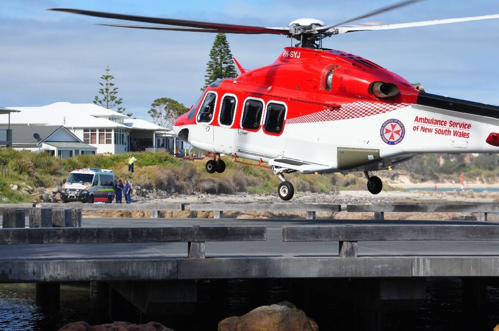 FATALITY: Emergency services at Currarong boat ramp Thursday morning where a diver in his 20s was killed after allegedly being hit by a boat propeller.