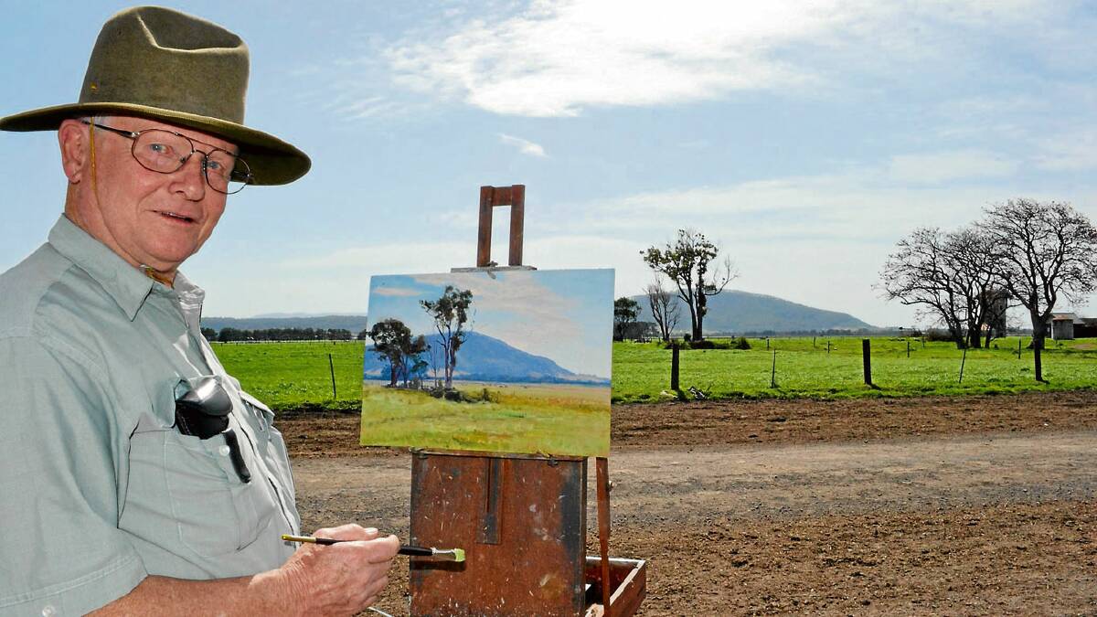 ART IMITATES LIFE: Renowned local artist John Downton with one of his latest creations painted at Numbaa, east of Nowra.