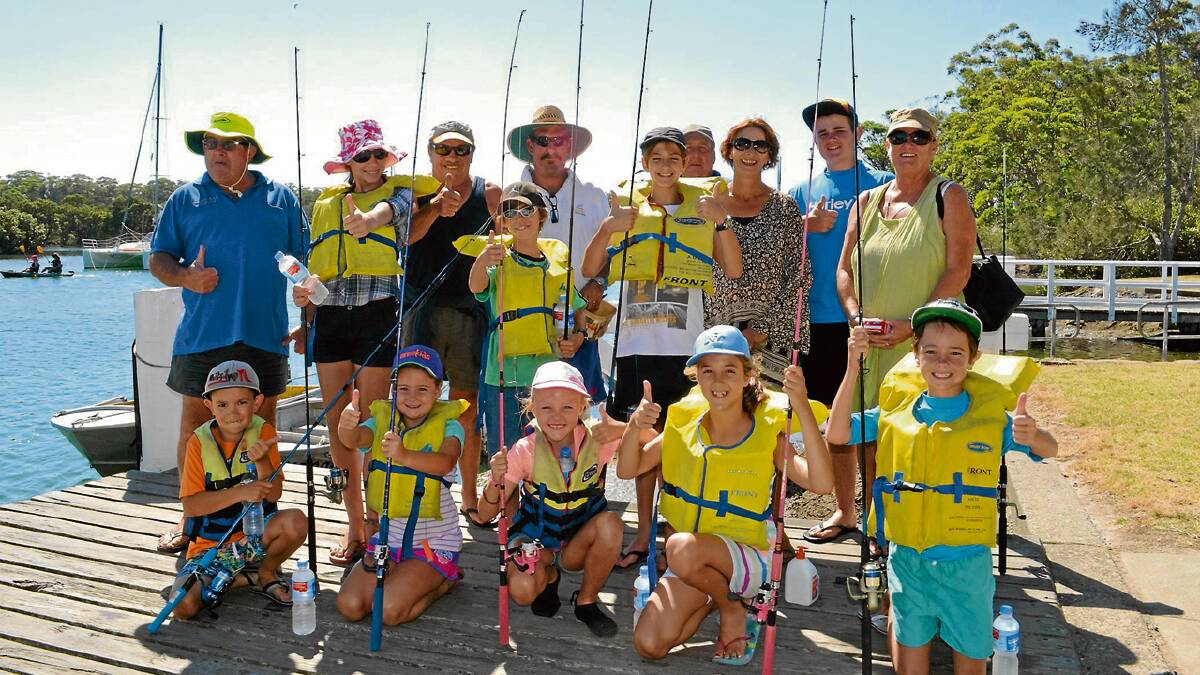 FISH FINDERS: Participants in the Huskisson RSL Fishing Club’s fishing school with club members (back, from left) Larry Sheldrick, Garry Hurley, Errol Wray, Wayne Smith, Michelle Hurley, Jacob Rennex from Camden, Christine Wray. Middle: Aimee and Adam Black from Mt Gambier, Adrijan Ilic from Sydney. Front: Rory Stone from Wrights Beach, Erin Woolnough from Camden, Madi Tansley from Sydney, April Ilic from Sydney and Ethan Woolnough from Camden.	Photo: ROBERT CRAWFORD