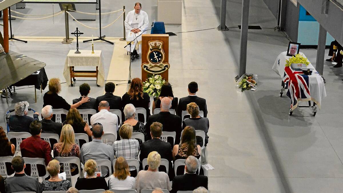 LAST RESPECTS: Family, friends and work colleagues packed into the Fleet Air Arm Museum at HMAS Albatross on Friday to pay their last respects to Nowra based senior sailor Kane Vandenberg.
