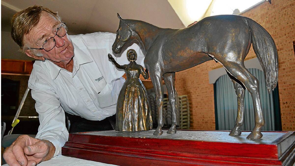 CHAMPION TRAINER: Worrigee House Reception Centre owner Merv Bennett with the Dennis Adams statue of Mrs de Mestre feeding Melbourne Cup winner Archer that has been suggested could be part of a planned revitalisation of the Egans Lane precinct in the Nowra CBD.