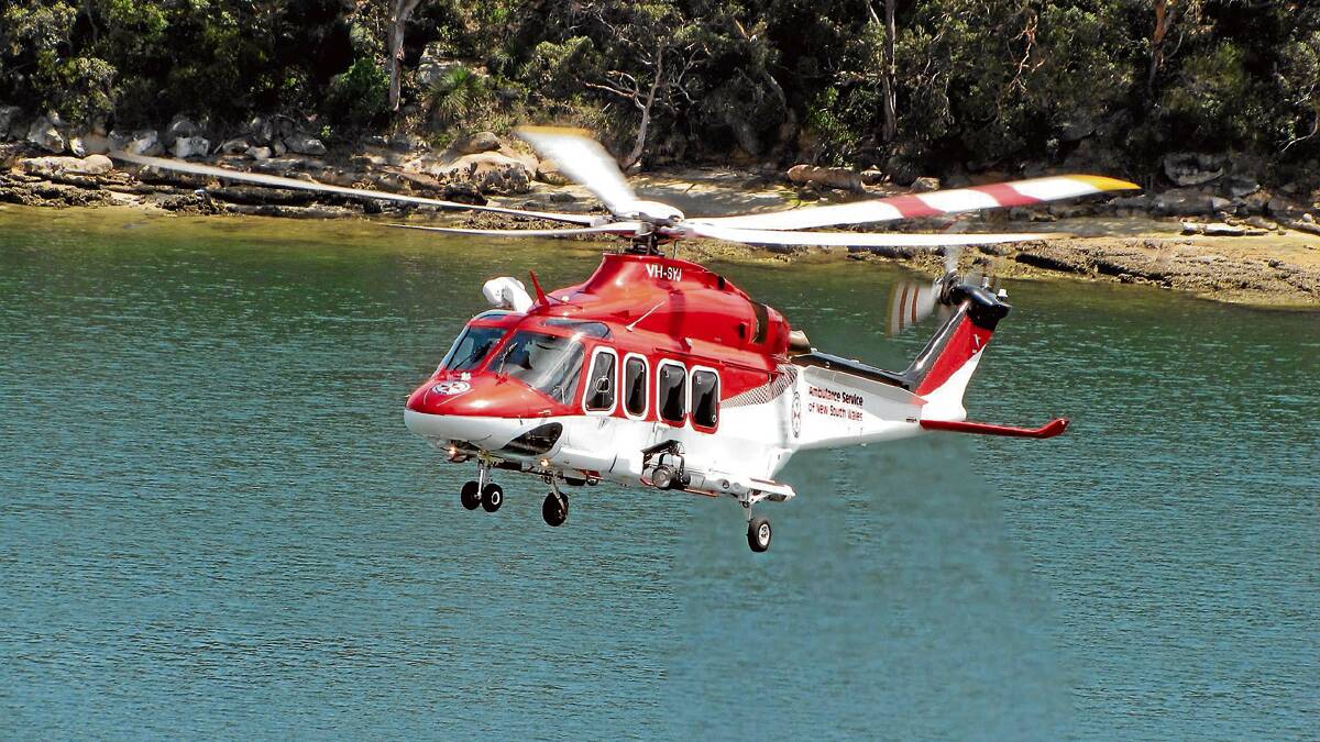 RESCUE TEAM: A NSW Ambulance rescue helicopter landed at a Huskisson sports field to transfer a nine-year-old boy who had gone into cardiac arrest while at the beach with his family on Thursday. 