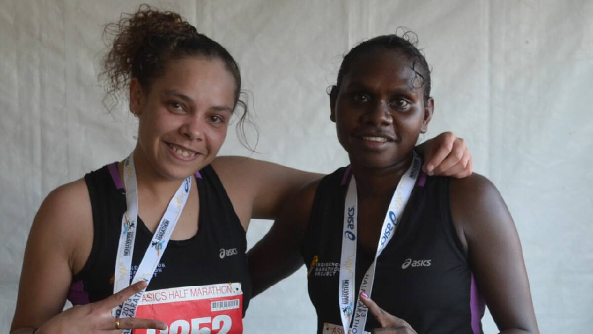 MARATHON MACHINE: Nowra runner Lisa Bloxsome, left, with fellow Indigenous Marathon Project runner Evelyna Dhamrrandji. 